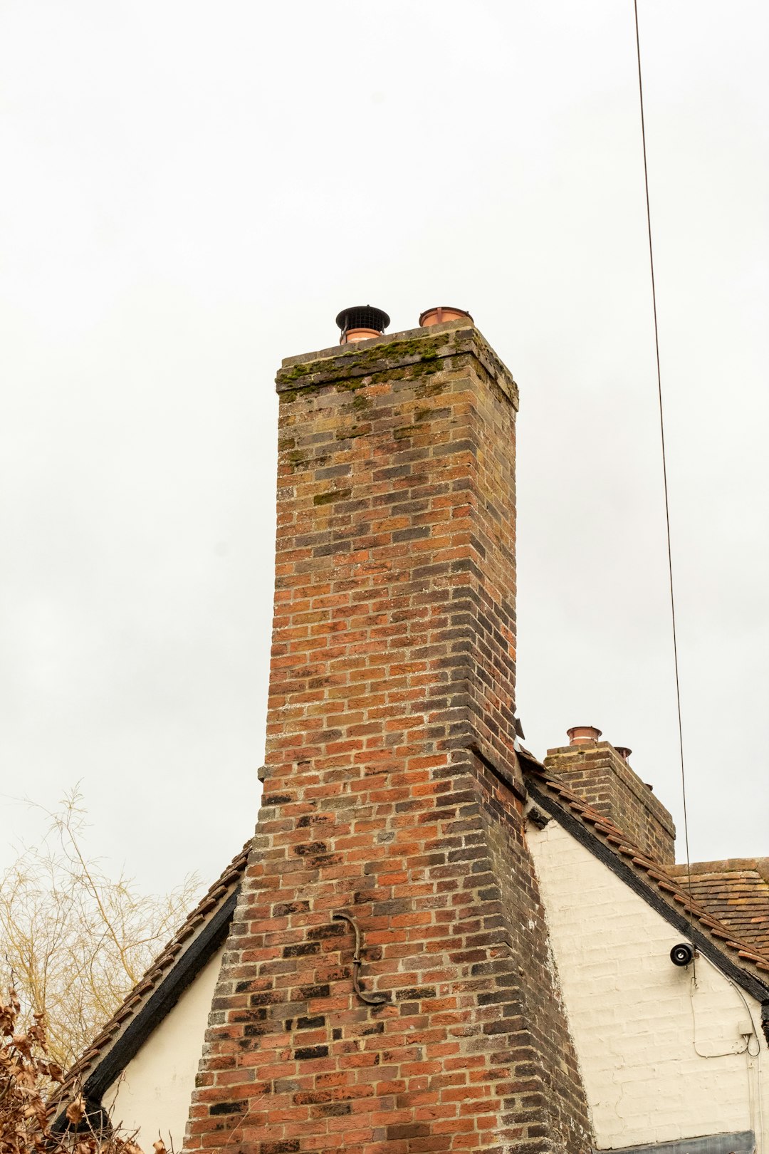 Professional chimney inspection technician performing chimney service in Texas